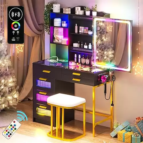 RGB Vanity Desk with Sliding Mirror and Lights, LED Makeup Vanity with Charging Station/Motion Sensor Light, Glass Top Vanities Dressing Table Set with Jewelry Box,6 Drawers,Stool (Black)